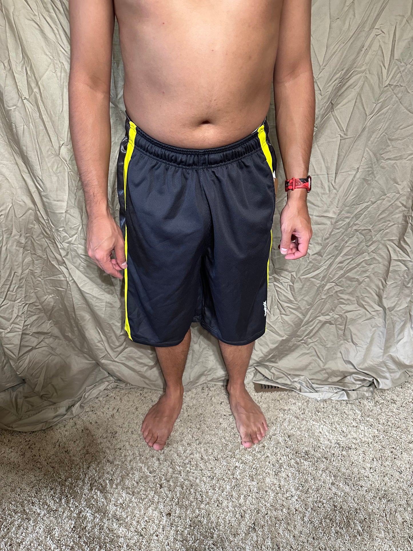 Men’s grey and yellow Reebok size medium performance athletic shorts with pockets