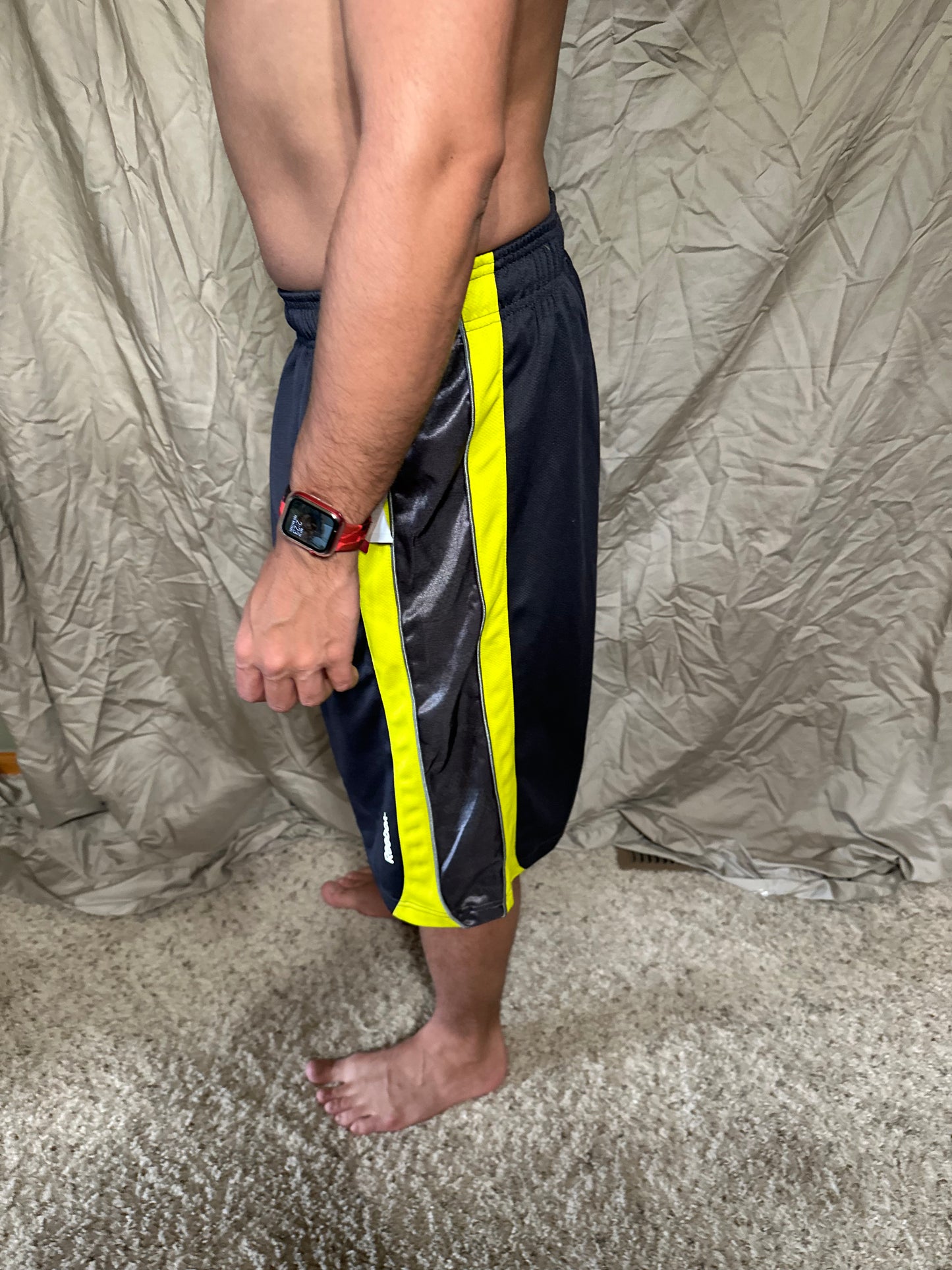 Men’s grey and yellow Reebok size medium performance athletic shorts with pockets