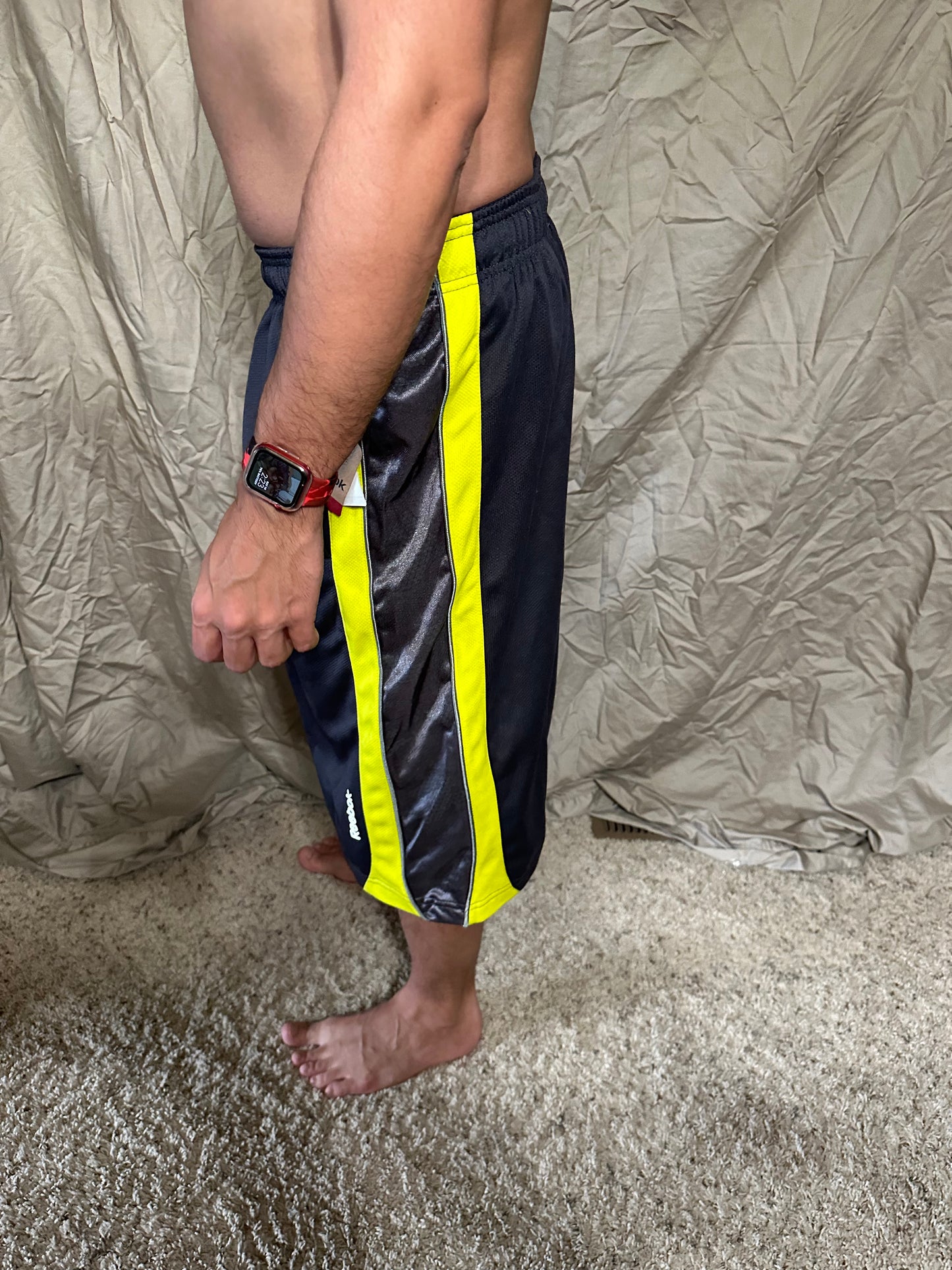 Men’s grey and yellow Reebok size medium performance athletic shorts with pockets