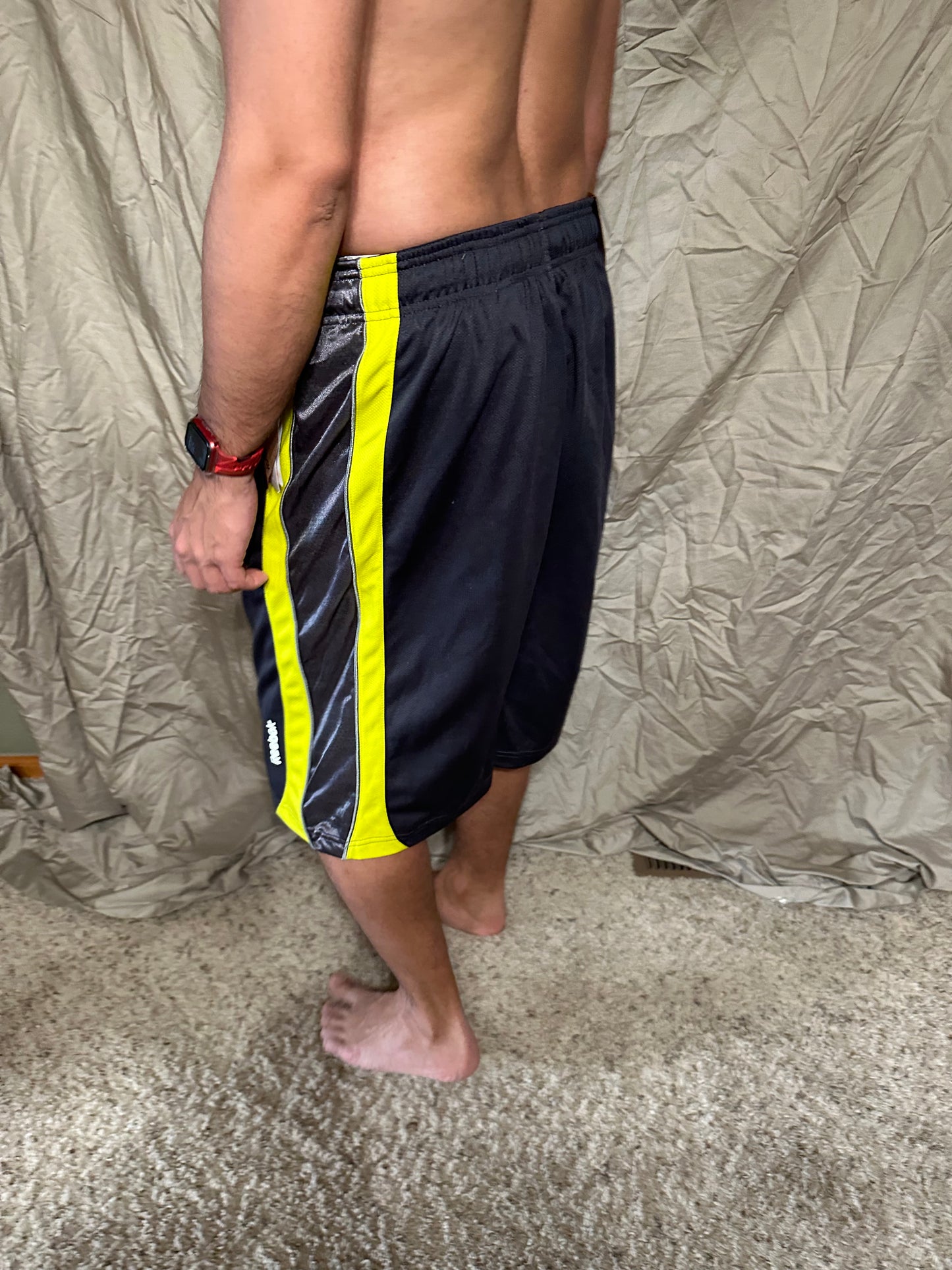 Men’s grey and yellow Reebok size medium performance athletic shorts with pockets