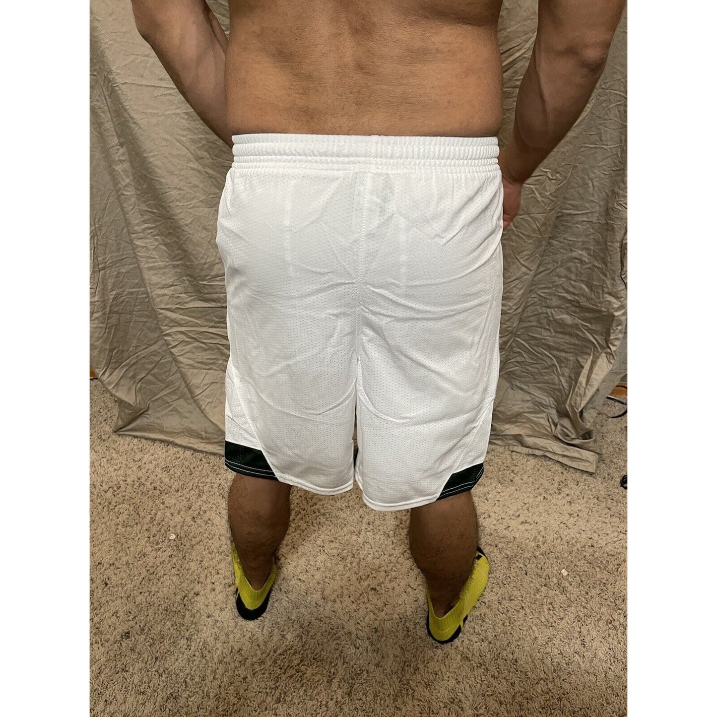 Boy's under armour Youth XL white and Green Lacrosse style shorts no pockets