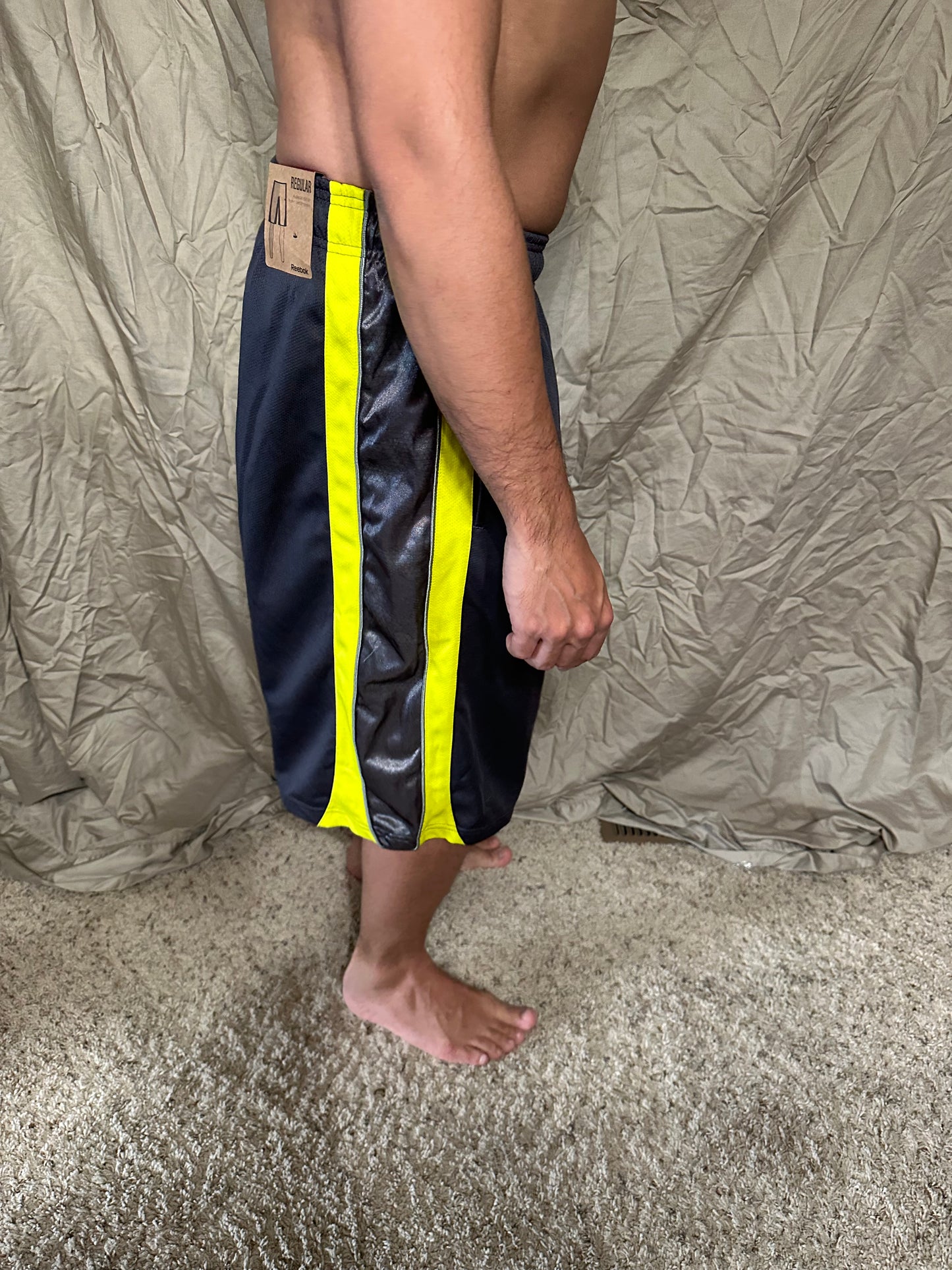 Men’s grey and yellow Reebok size medium performance athletic shorts with pockets