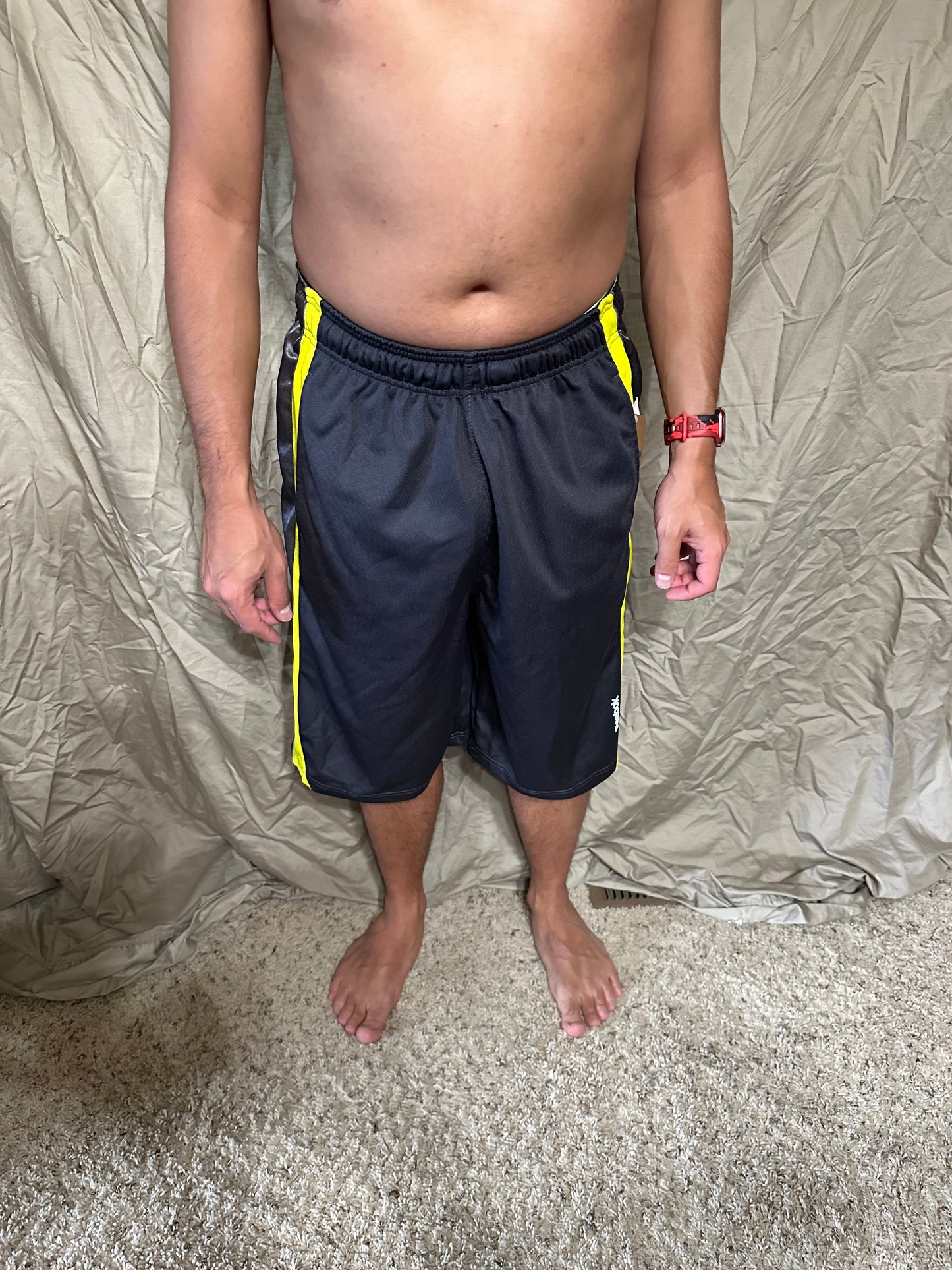 Men’s grey and yellow Reebok size medium performance athletic shorts with pockets