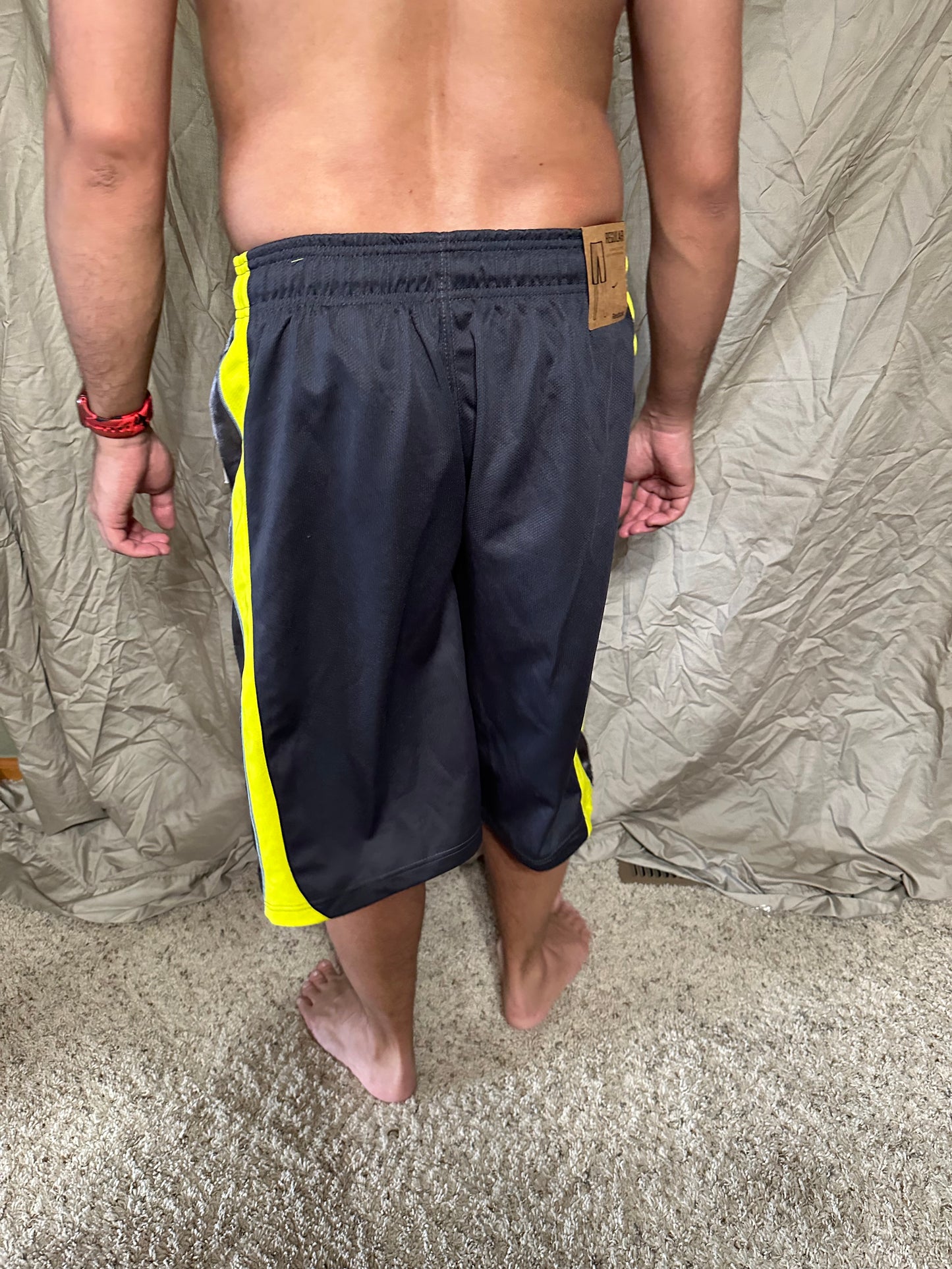 Men’s grey and yellow Reebok size medium performance athletic shorts with pockets