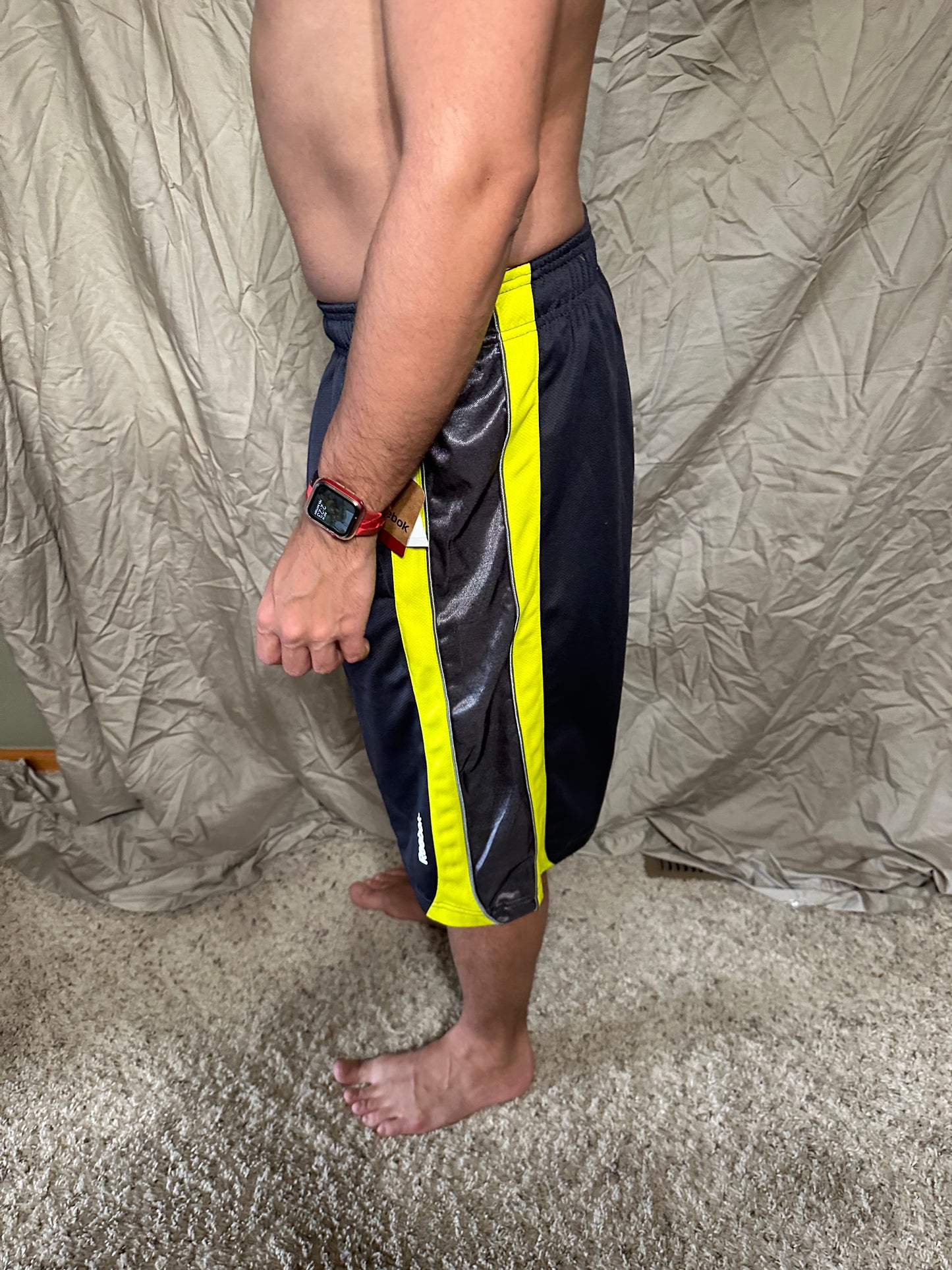 Men’s grey and yellow Reebok size medium performance athletic shorts with pockets