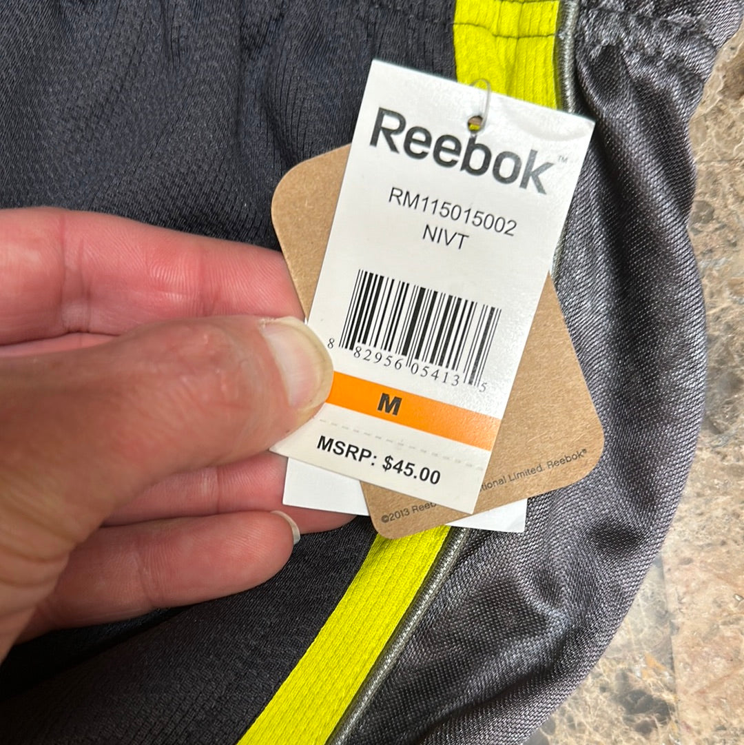 Men’s grey and yellow Reebok size medium performance athletic shorts with pockets