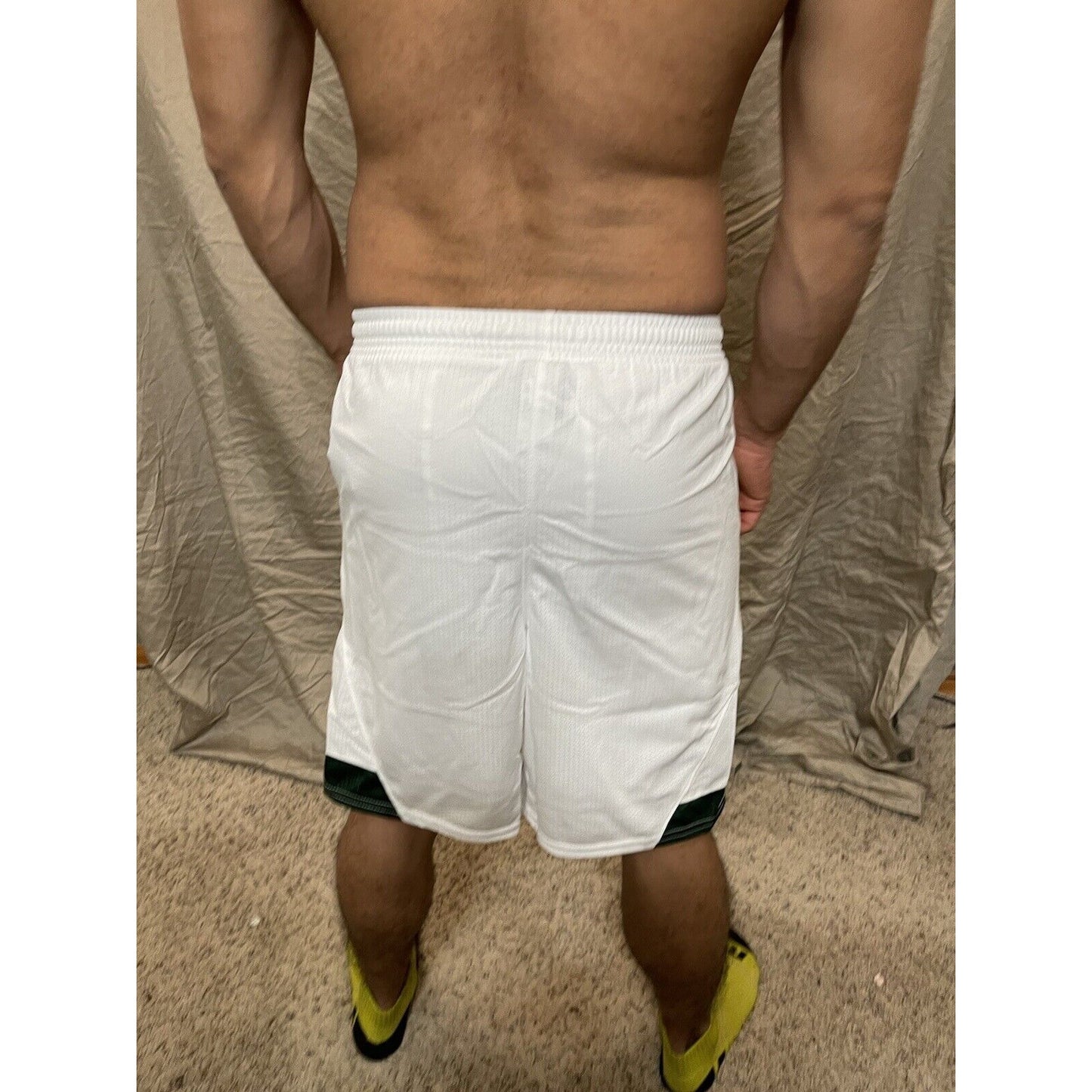 Boy's under armour Youth XL white and Green Lacrosse style shorts no pockets