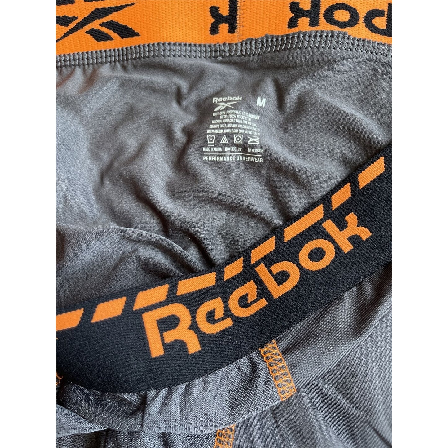 Men's gray reebok medium orange band compression shorts