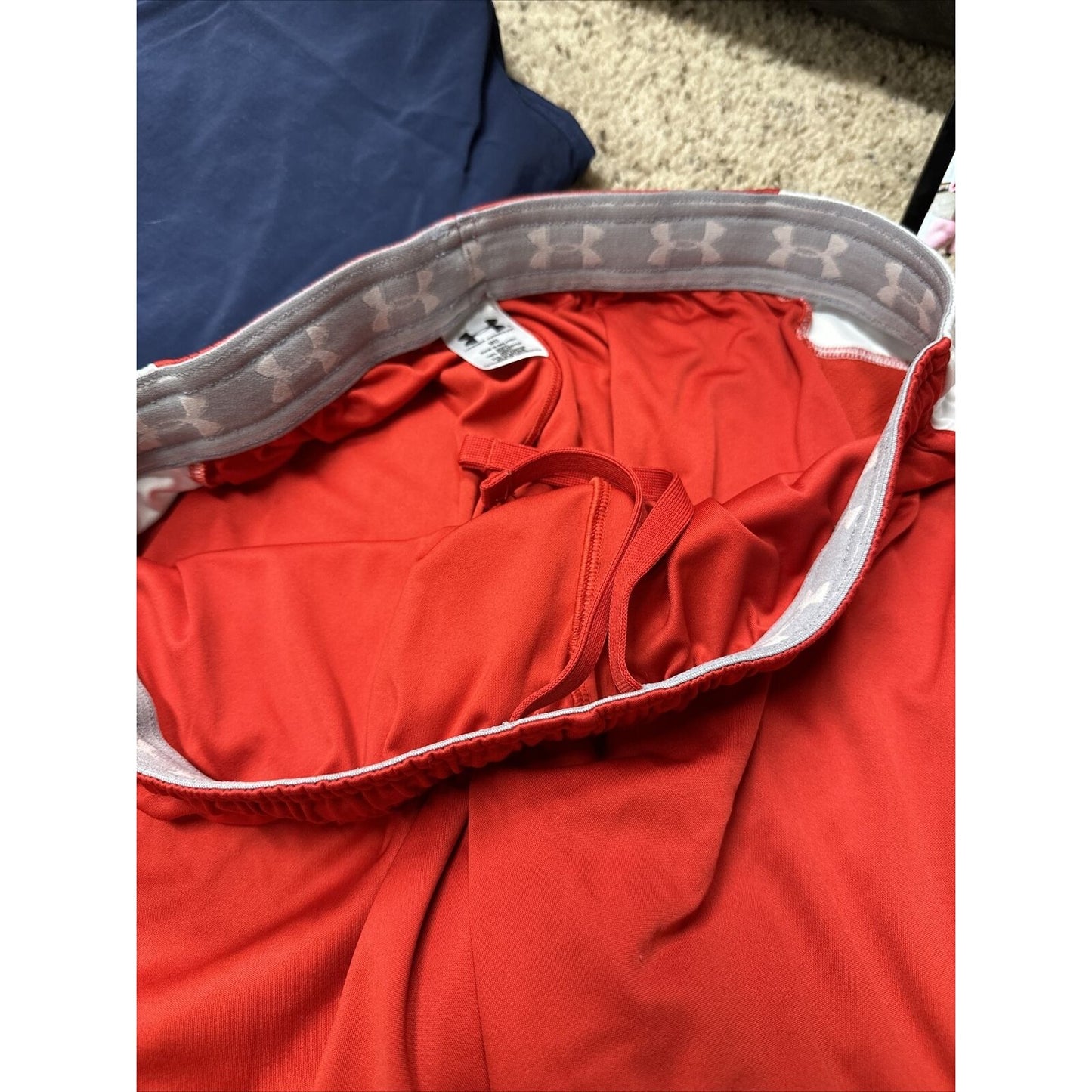 men’s medium under armour red and white athletic shorts