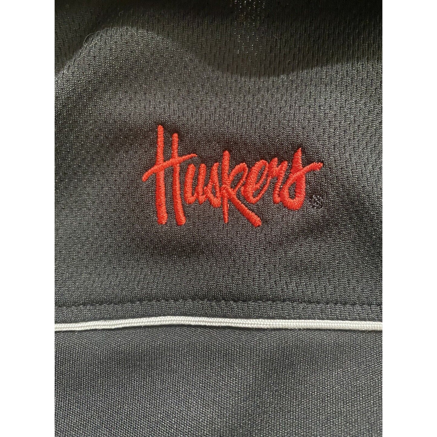 Nebraska Huskers Black Microfiber Cutter & Buck Athletic Polo Shirt