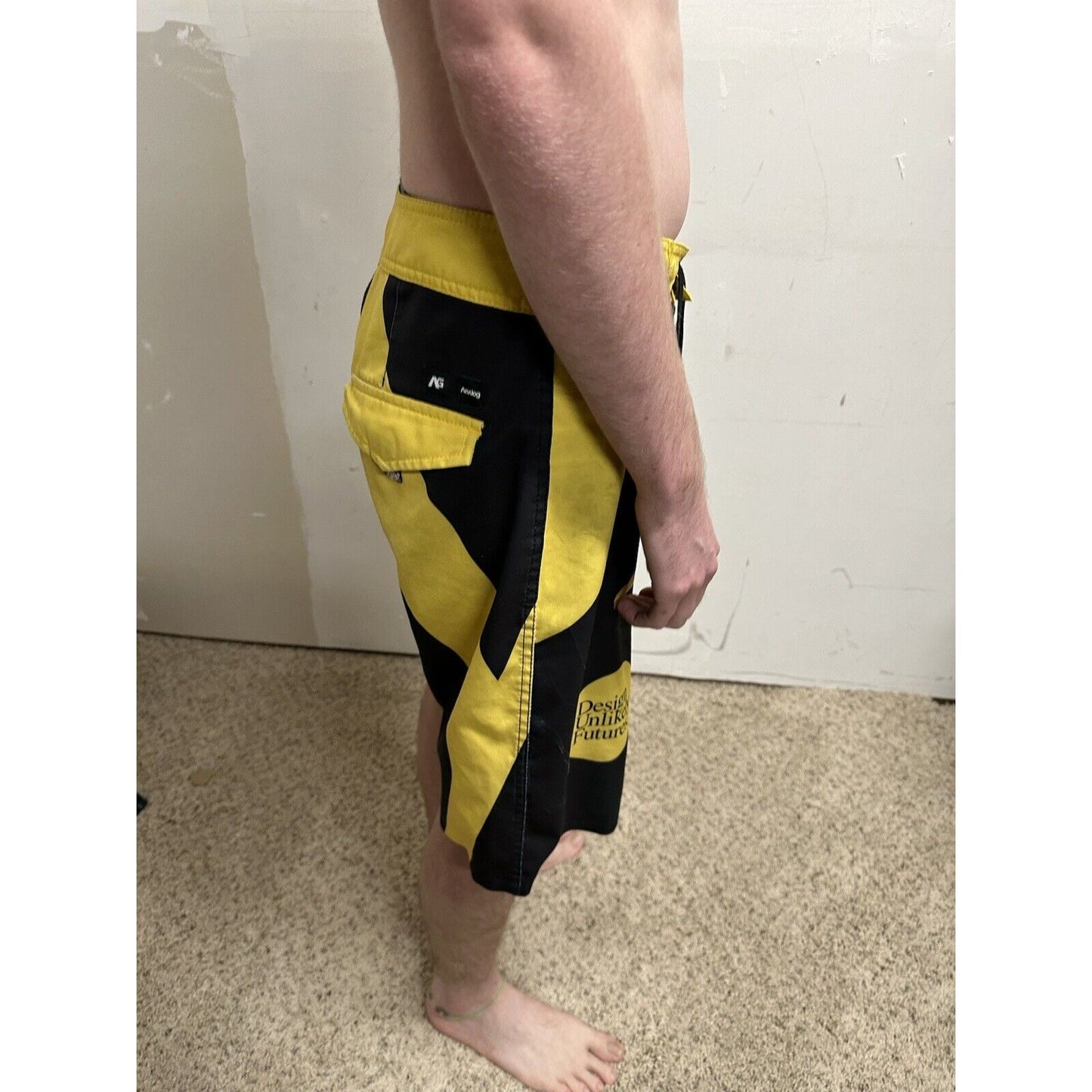 men’s analog skze 33 design unlikely futures yellow and black board shorts