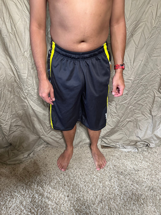 Men’s grey and yellow Reebok size medium performance athletic shorts with pockets