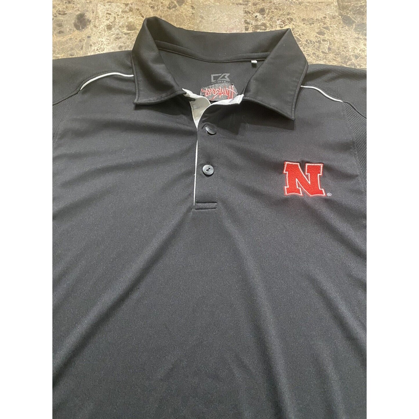 Nebraska Huskers Black Microfiber Cutter & Buck Athletic Polo Shirt